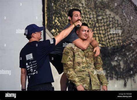 Ufc Fighter Tim Kennedy Demonstrates A Choke Hold On A Soldier As Actor