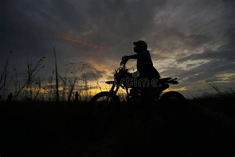 Silhouette Of A Man Riding His Motorcycle During Sunset. Stock Image - Image of biker, black ...