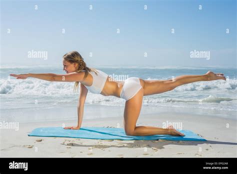 Gorgeous Fit Blonde In Pilates Pose On The Beach Stock Photo Alamy