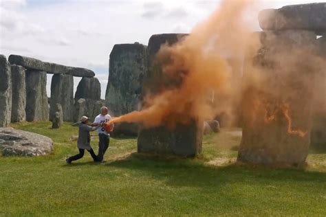 climate activists spray stonehenge  orange paint  viral protest