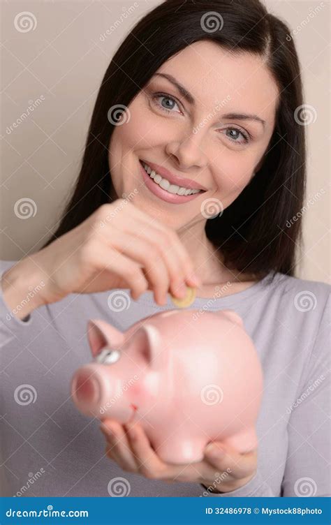 Her Savings Portrait Of Beautiful Middle Aged Women Putting Coins To