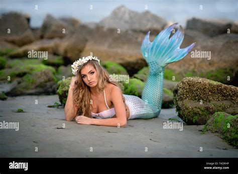 Beautiful Mermaid On Rocky Beach Stock Photo Alamy