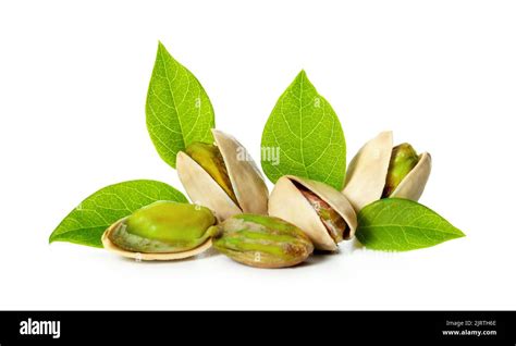 Pistachio Nuts With Leaves Isolated On White Background Stock Photo Alamy