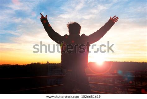 Silhouette Man Hands Raised Sunset Concept Stock Photo