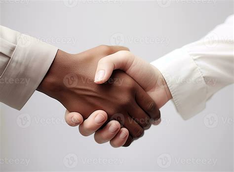 Handshake Between Two People From Different Races Diversity Concept