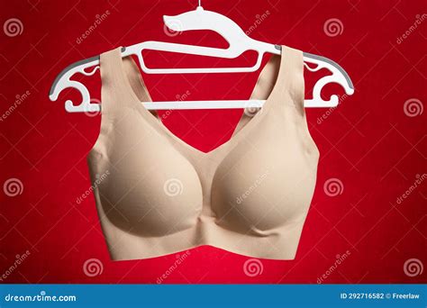 A Beige Bra Hanging On Red Background Stock Photo Image Of Lady