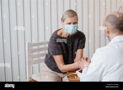 Doctor Calms The Agitated Patient During The Visit Stock Photo Alamy