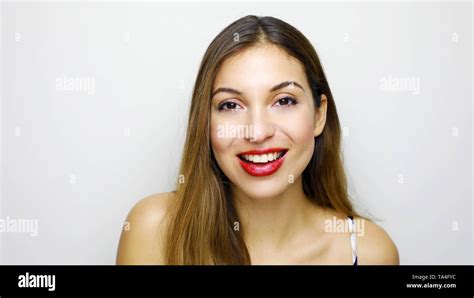 Portrait Of Young Beautiful Shy Girl Smiling Looking At Camera Over