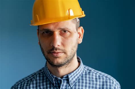 Premium Photo Portrait Of Man Wearing Hat Against Blue Background