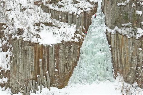 Two People Are Climbing A Frozen Photograph by Andrew Peacock - Pixels