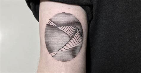 Geometric Wave Tattoo On The Back Of The Left Arm