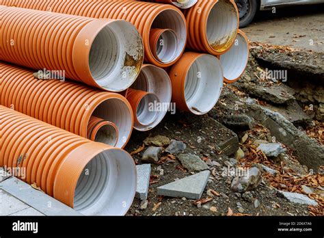 PVC Tubes Plastic Pipes Stacked In Rows At A Construction Site On