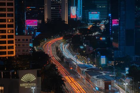 Night cityscape,and traffic light of highway in slow speed shutter ...