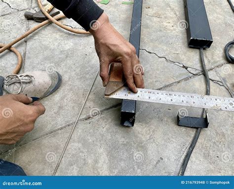 Mechanical Engineer Use Ruler To Measuring The Metal Frame Before