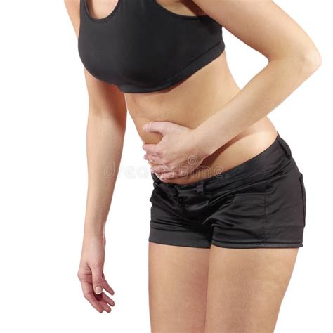 Woman With Palm Around Waistline To Show Pain On Belly Area Stock Photo