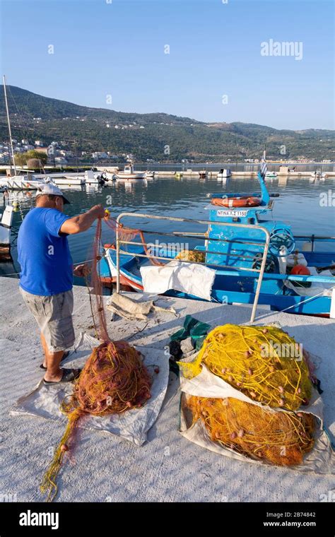 Fisherman Attending Nets Samos Town Samos Greece Stock Photo Alamy