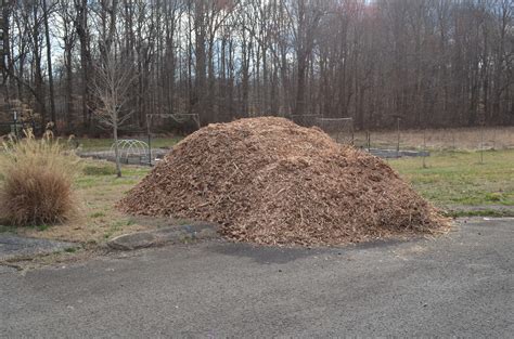 How to spread tall mounds of wood chips (mulch forum at permies)