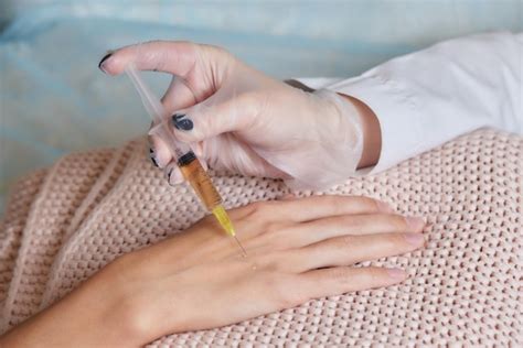 Premium Photo Doctor Doing Stem Cell Therapy On A Patients Elbow