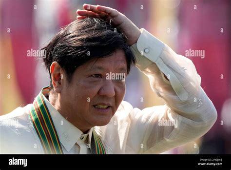 Philippine President Ferdinand Marcos Jr Arranges His Hair As He