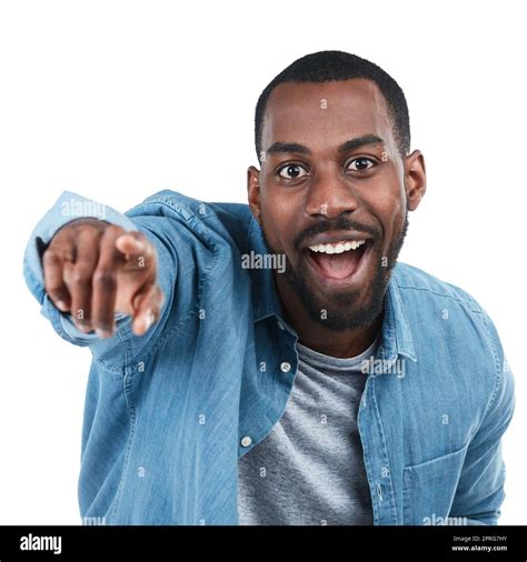 Check It Out Cropped Portrait Of A Young Man Pointing Excitedly