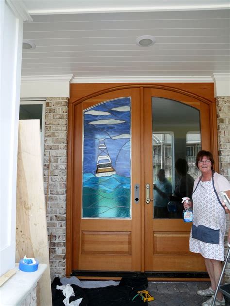 Stained Glass Artist Pam Mccorkhill Installing A Stained Glass Design In A Door In Atlantic