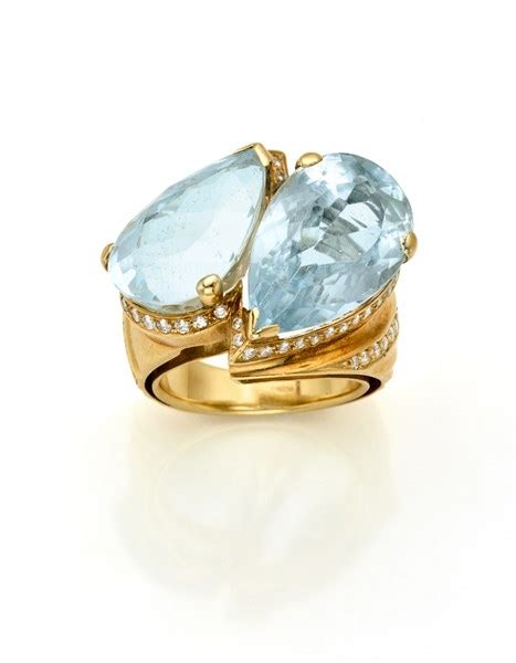 Anello A Contrari In Oro Giallo Con Diamanti E Due Acquamarine A