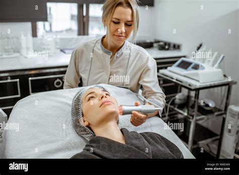 Female Cosmetologist Making Oxygen Mesotherapy To A Woman At The Luxury