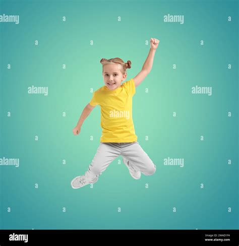 Happy Cute Girl Jumping On Color Gradient Background Stock Photo Alamy