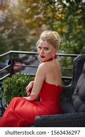 Portrait Sexy Blonde Red Dress Sitting Stock Photo