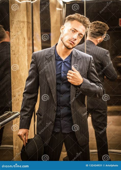 Handsome Young Man Inside An Elevator Looking At Camera Stock Image