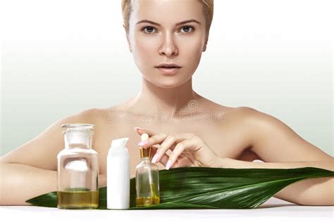 Beautiful Woman Applies Organic Cosmetic And Oils For Beauty Spa And