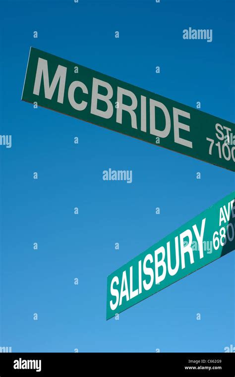 Green Street Sign Against Blue Sky Stock Photo Alamy