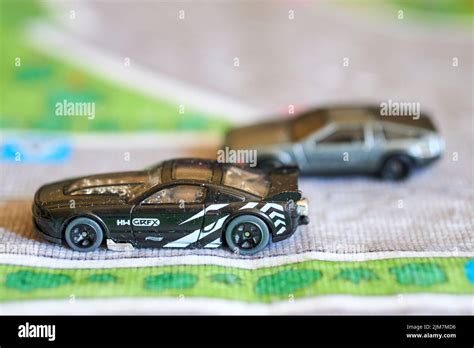 A Closeup Of A Mix Of Mattel Hot Wheels Black Toy Model Cars On A Play Road Mat Stock Photo Alamy