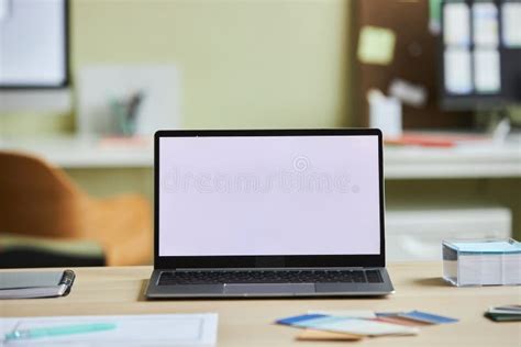 Open Laptop With Blank White Screen Mock Up On Desk In Office Stock