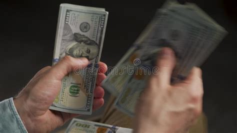 Male Hands Counting US Dollar Bills Or Paying In Cash Extreme Close Up