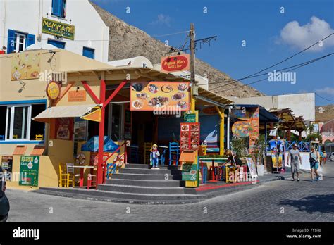 A bright coloured restaurant in Kamari, Santorini, Greece Stock Photo ...