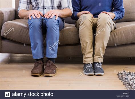 Gay Couple Relaxing On Couch Stock Photos Gay Couple Relaxing On Couch Stock Images Alamy