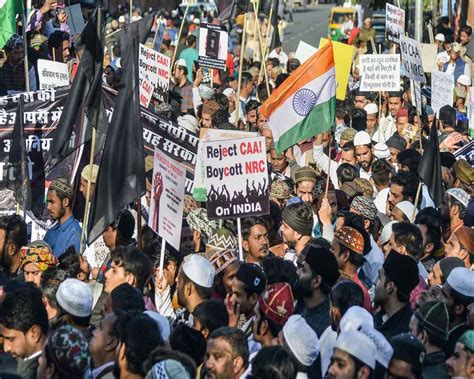 Today S Photo A Protestor Holds The National Flag During A Protest