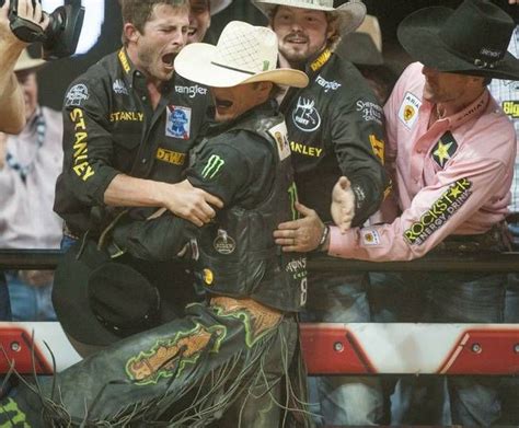 J B Mauney at PBR finals 2013 celebrating with the boys Stanly, Bull ...