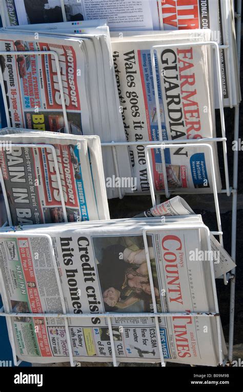 Uk British Local Regional And National Newspapers In Rack Outside