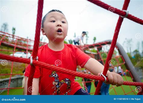 Menino Feliz No Campo De Jogos Foto De Stock Imagem De Lifestyle