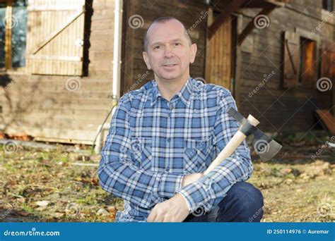 Man holding ax posing stock photo. Image of lumberman - 250114976