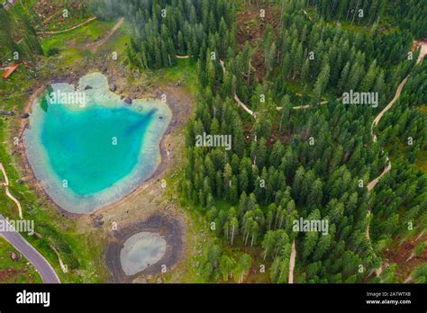 Aerial View Of Turquoise Blue Water Of Lake Carezza In Alps Dolomites