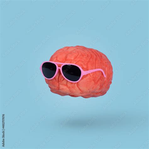 Funny Minimal Idea With A Human Brain Wearing Sunglasses Floating In