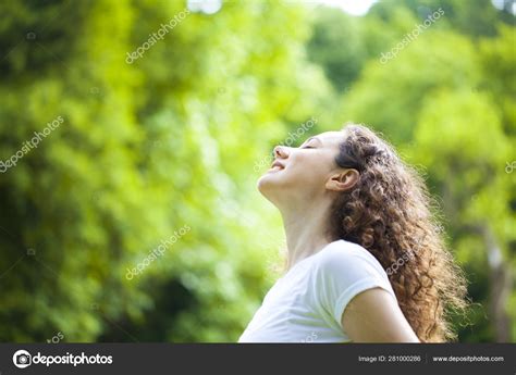 Woman Breathing Fresh Air Outdoors In Summer Stock Photo By