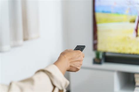 Premium Photo Elderly Woman Watching Smart Tv And Using Remote