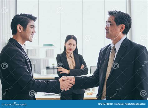 Group Of Asia Business People Meeting Close Up Of Two Business People