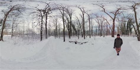 Man Walking Through Snowy Forest In 360 Degree Video Stock Video