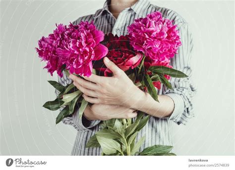 Portrait Of Woman Holding Bouquet Of Flowers A Royalty Free Stock