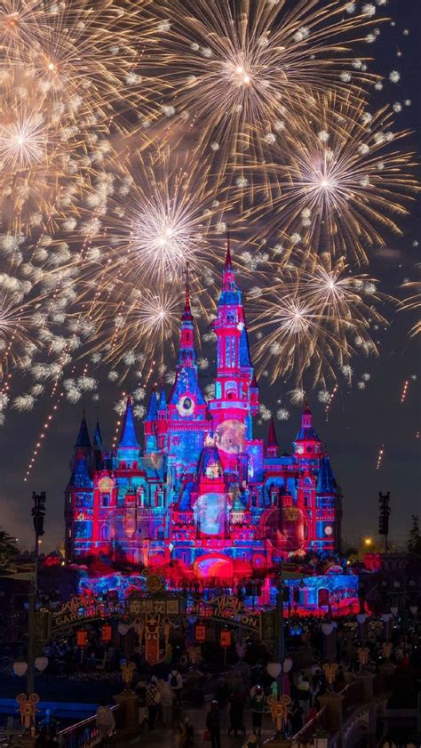 Fireworks Are Lit Up In The Sky Above A Castle